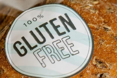 An artisan loaf with a ‘100% Gluten free’ sticker on it.
